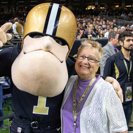Happy champion with Saints mascot